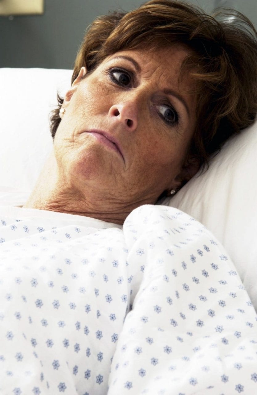 Sad Patient In Hospital Bed